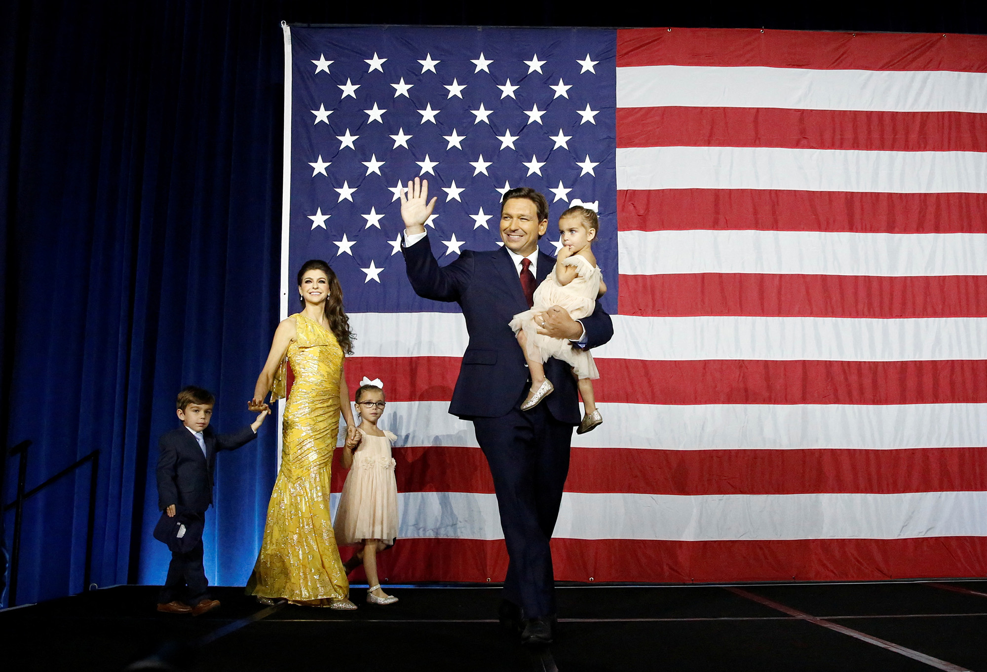 PHOTO: Republican Florida Governor Ron DeSantis waves from stage alongside his wife Casey and children during his 2022 U.S. midterm elections night party in Tampa, Fla., Nov. 8, 2022. 