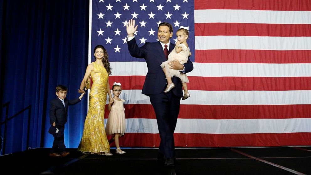 PHOTO: Republican Florida Governor Ron DeSantis waves from stage alongside his wife Casey and children during his 2022 U.S. midterm elections night party in Tampa, Fla., Nov. 8, 2022. 