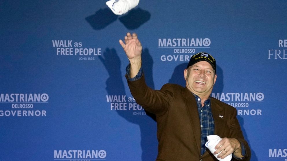 PHOTO: Pennsylvania Republican gubernatorial candidate Doug Mastriano throws T-shirts to people in the audience during an election night campaign event at the Penn Harris Hotel in Camp Hill, Pa., Nov. 8, 2022. 