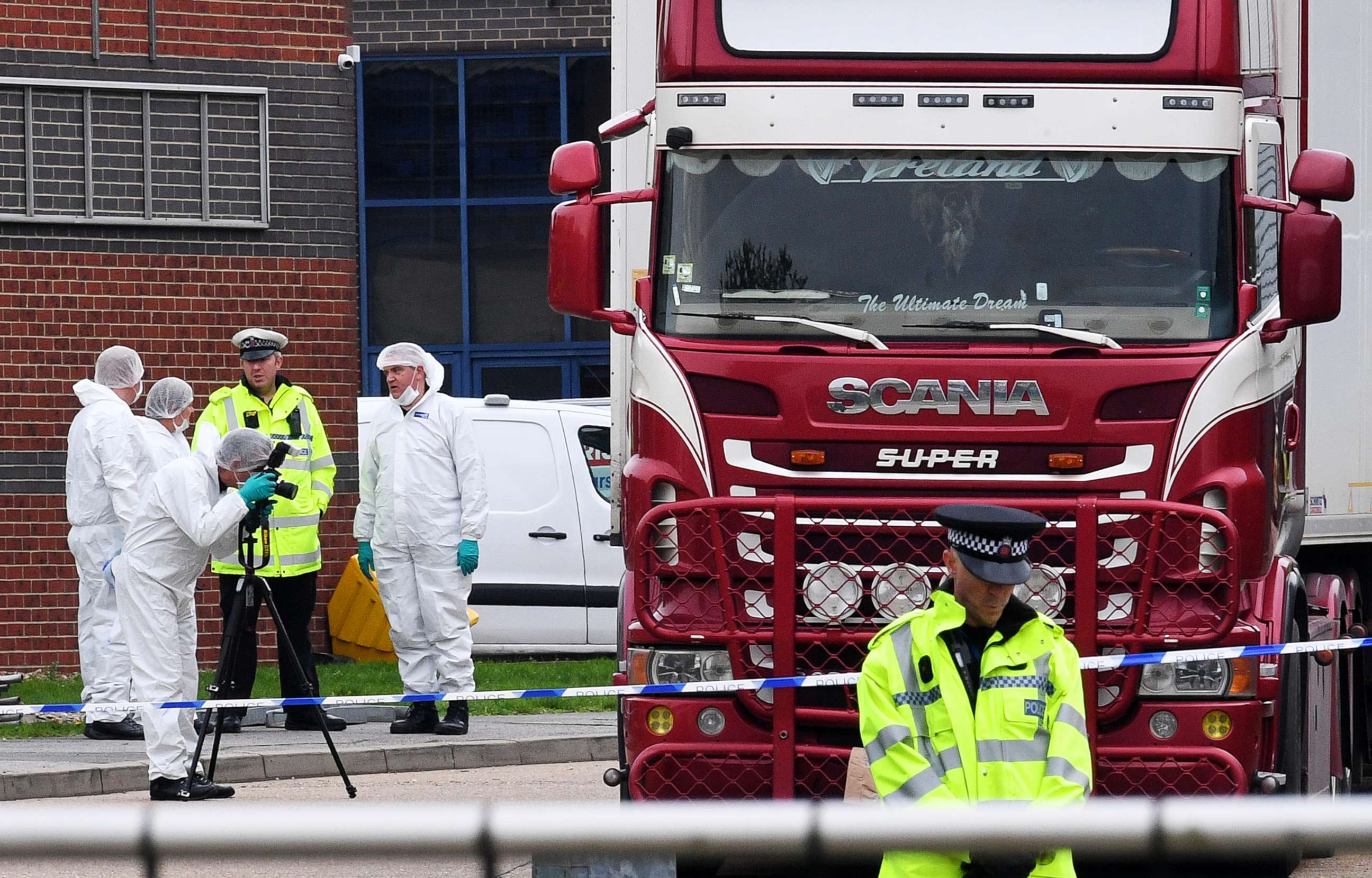 PHOTO: Police and forensic officers investigate a lorry in which 39 bodies were discovered in the trailer, as they prepare move the vehicle from the site on Oct. 23, 2019, in Thurrock, England.