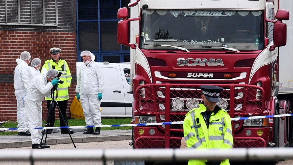 PHOTO: Police and forensic officers investigate a lorry in which 39 bodies were discovered in the trailer, as they prepare move the vehicle from the site on Oct. 23, 2019, in Thurrock, England.