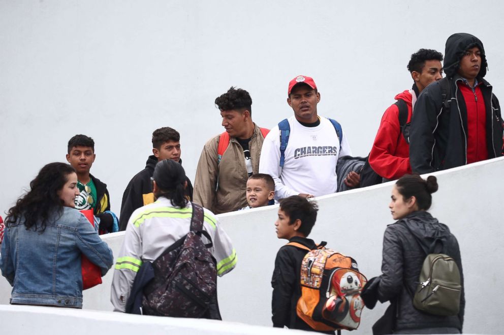 PHOTO: Members of a caravan of migrants from Central America enter the United States border and customs facility near Tijuana, Mexico, where they are expected to apply for asylum, May 2, 2018.