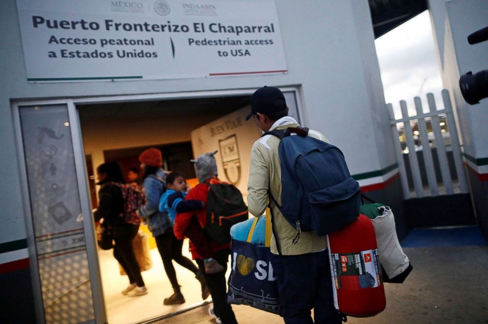 PHOTO: Members of a caravan of migrants from Central America enter the United States border and customs facility, where they are expected to apply for asylum, in Tijuana, Mexico, May 2, 2018.