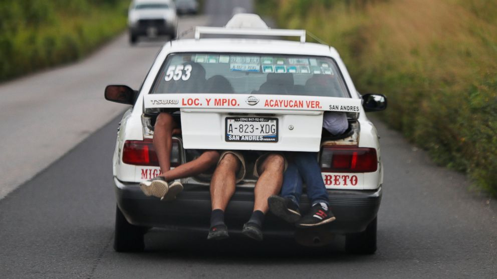 PHOTO: Central American migrants, part of the caravan hoping to reach the U.S. border, a ride on in the trunk of a taxi, in Acayucan, Veracruz state, Mexico, Saturday, Nov. 3, 2018.