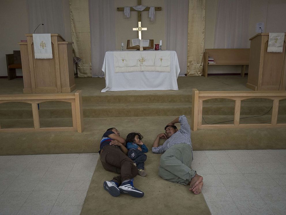 PHOTO: Migrants from Guatemala rest near the altar at the El Calvario Methodist Church which is housing migrants who are seeking asylum after being released by the U.S. Immigration and Customs Enforcement, June 3, 2019, in Las Cruces, New Mexico.