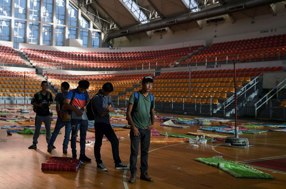 PHOTO:Central American migrants wait after they were detained during an operation at an improvised shelter in Veracruz, Mexico, June 28, 2019. 