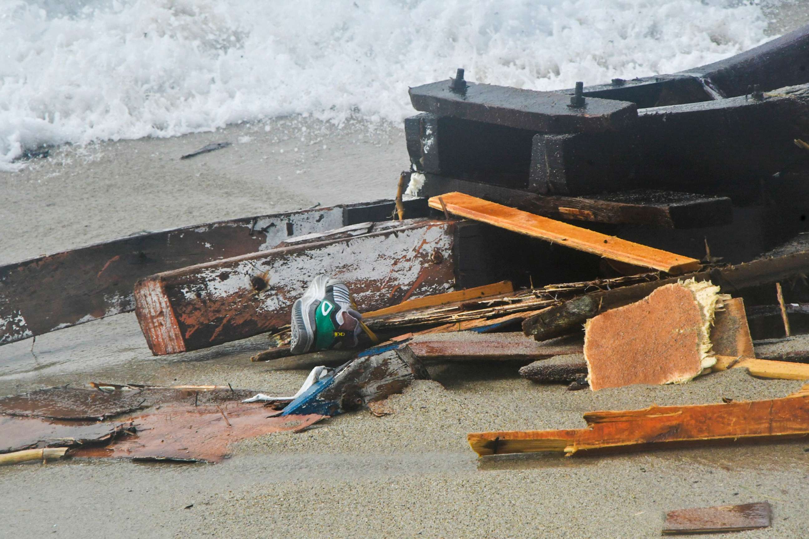 PHOTO: The wreckage from a capsized boat washes ashore at a beach near Cutro, southern Italy, Feb. 26, 2023.