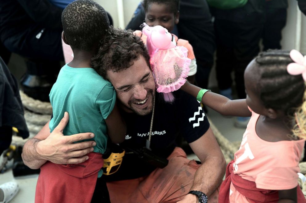 PHOTO: A crew member hugs a migrant child aboard the Aquarius rescue ship before disembarking in the port of Valencia, Spain, June 17, 2018.