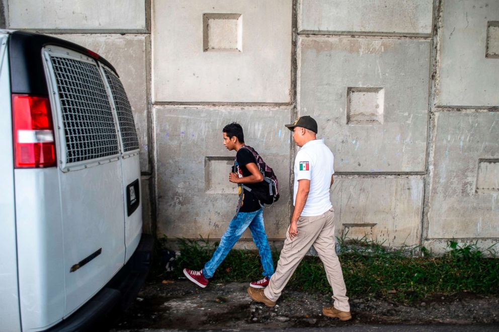 PHOTO: A Guatemalan migrant who traveled through the public transportation system without documents is detained by Mexican immigration agents in the outskirts of Ciudad Hidalgo, Chiapas state, Mexico, Aug. 10, 2018.