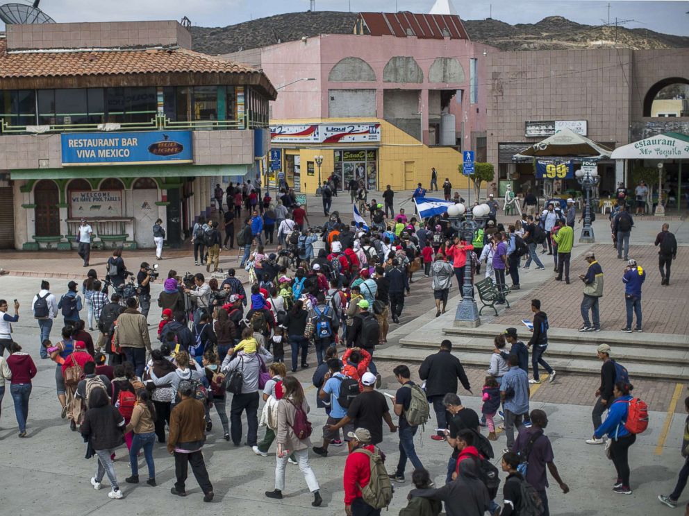 PHOTO: Members of a caravan of Central Americans who spent weeks traveling across Mexico walk from Mexico to the U.S. side of the border to ask authorities for asylum on April 29, 2018 in Tijuana, Baja California Norte, Mexico.