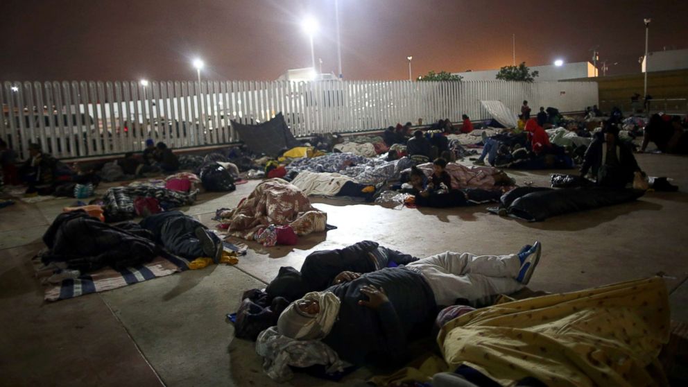 Members of a caravan of migrants from Central America sleep near the San Ysidro checkpoint after a small group of fellow migrants entered the U.S. border and customs facility, where they are expected to apply for asylum in Tijuana, Mexico, April 29, 2018.