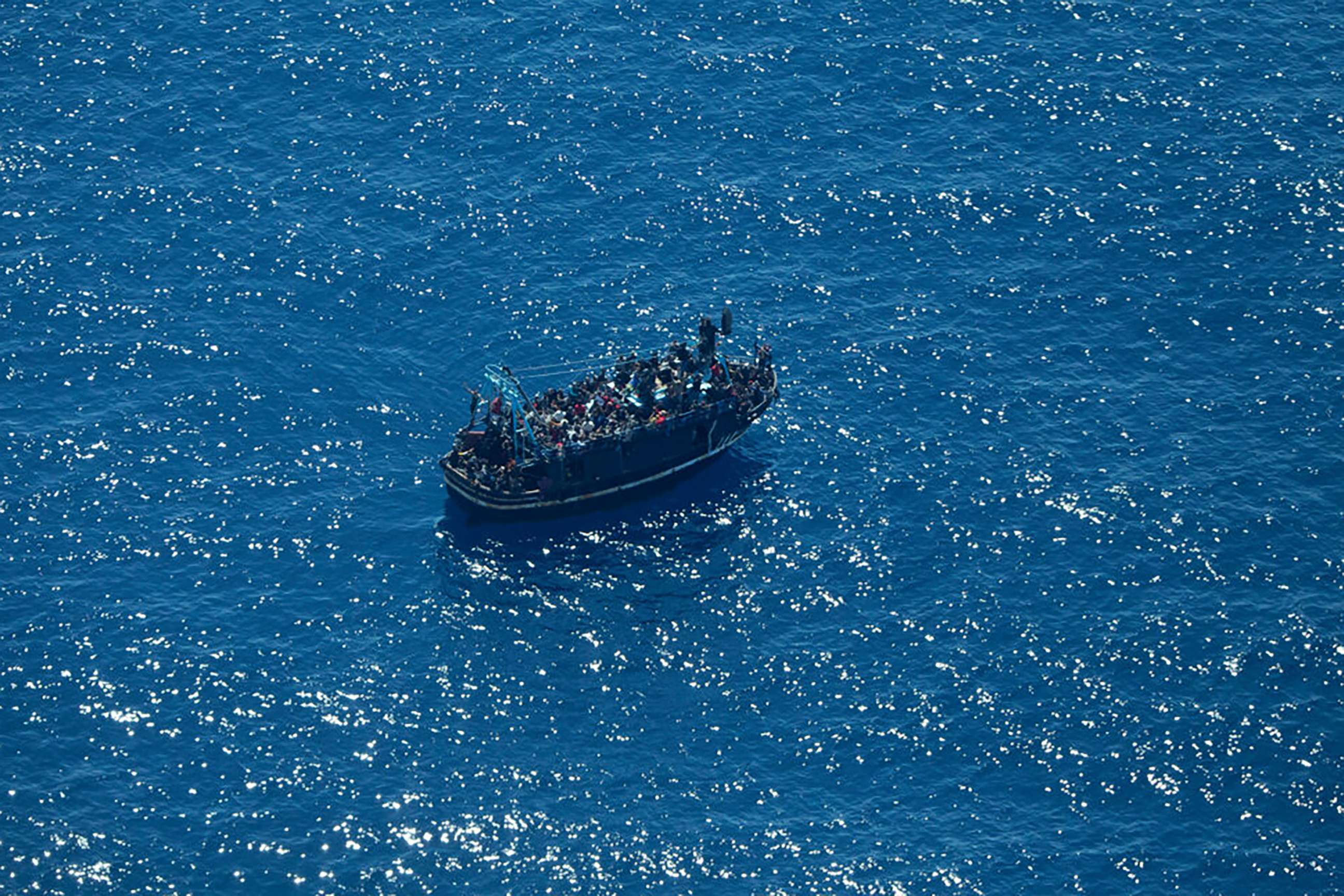 PHOTO:A picture provided by German humanitarian organization Sea-watch showing a boat in distress with some 400 people on board in the central Mediterranean, April 9, 2023.