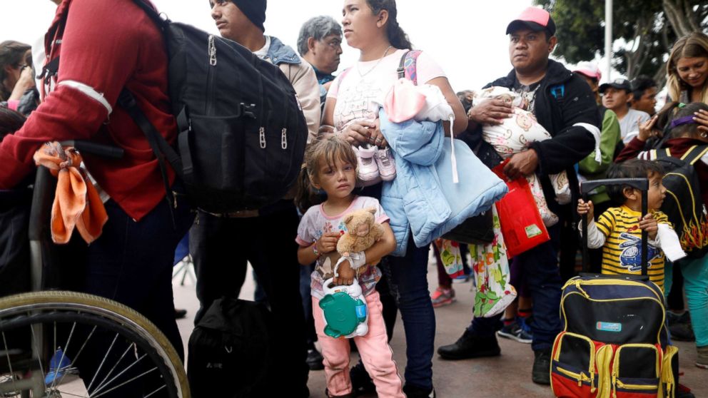 PHOTO: Members of a caravan of migrants from Central America wait to enter the United States border and customs facility, where they are expected to apply for asylum, in Tijuana, Mexico April 29, 2018.
