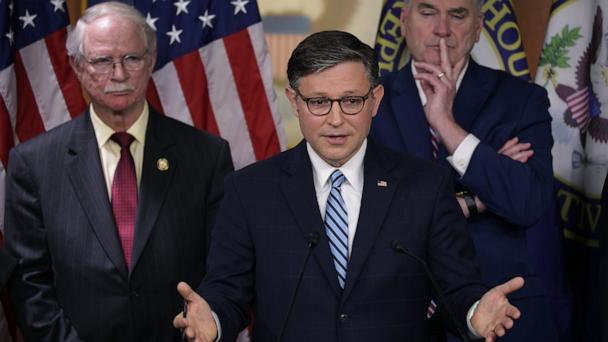 Speaker of the House Rep. Mike Johnson speaks as Rep. John Rutherford and House Majority Whip Rep. Tom Emmer listen during a news conference at the U.S. Capitol, May 14, 2025 in Washington.