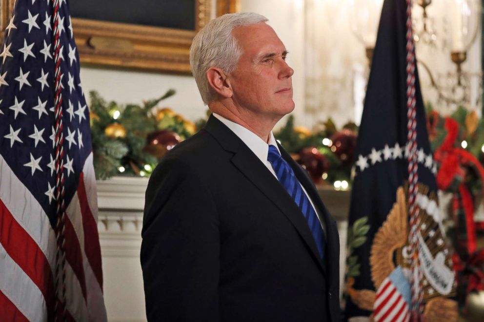 PHOTO: Vice President Mike Pence listens as President Donald Trump speaks in the Diplomatic Reception Room of the White House, Dec. 6, 2017, in Washington. 