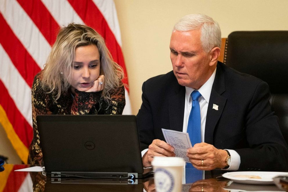 PHOTO: Vice President Mike Pence, with his daughter Charlotte, works on the speech he would give to the joint session when Congress reconvened to certify Joe Biden's election after he returned to the Capitol on Jan. 6, 2021.
