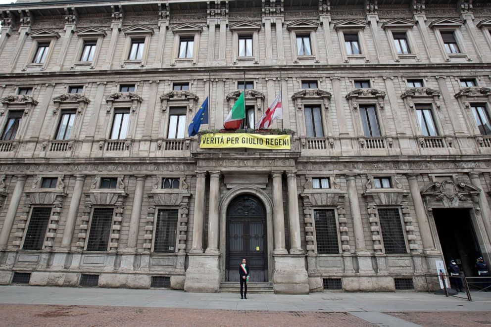 PHOTO: Milan's mayor Giuseppe Sala observes a minute of silence outside the city hall where flags fly at half-mast to honor the victims of the coronavirus pandemic, in Milan, Italy, March 31, 2020.