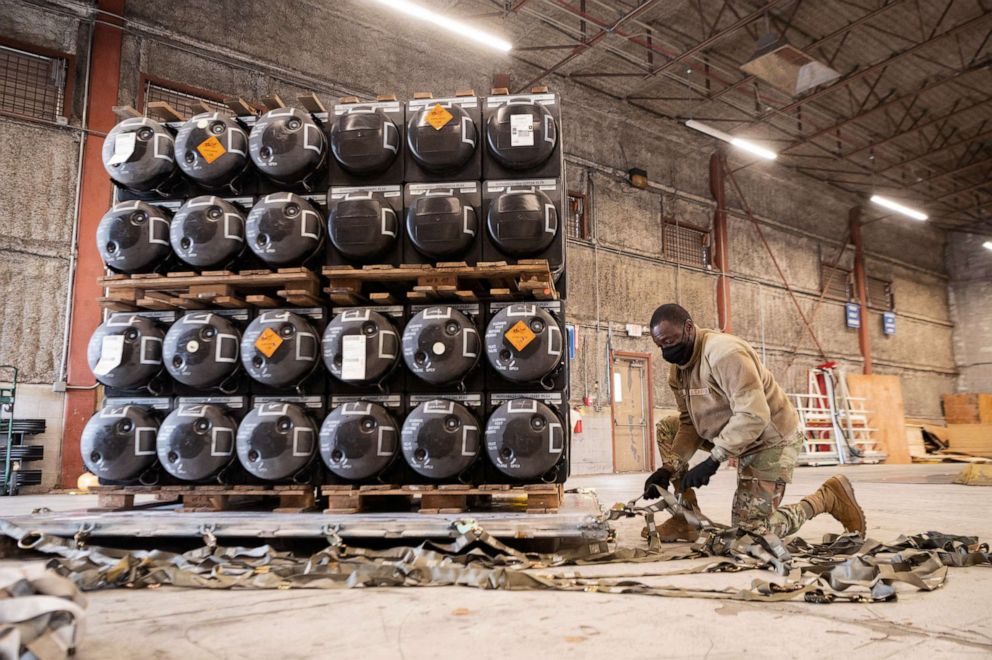 PHOTO: Airman 1st Class Olabode Igandan palletizes ammunition, weapons and other equipment bound for Ukraine during a foreign military sales mission at Dover Air Force Base, in Delaware, January 21, 2022. Picture taken January 21, 2022.