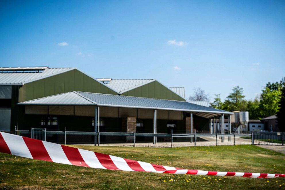 PHOTO: Barrier tape cordons off buildings at a mink farm in the southeastern town of Beek en Donk in the Netherlands on April 26, 2020, after tests showed that animals within had been infected with the novel coronavirus.