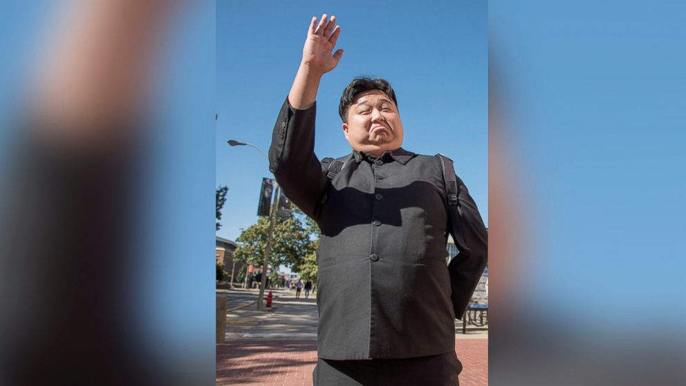 Minyong Kim of South Korea has parlayed his resemblance to North Korea's Kim Jong Un into a part-time hobby, part-time acting career, waves in Urbana, Ill., in this Oct. 14, 2015 file photo.