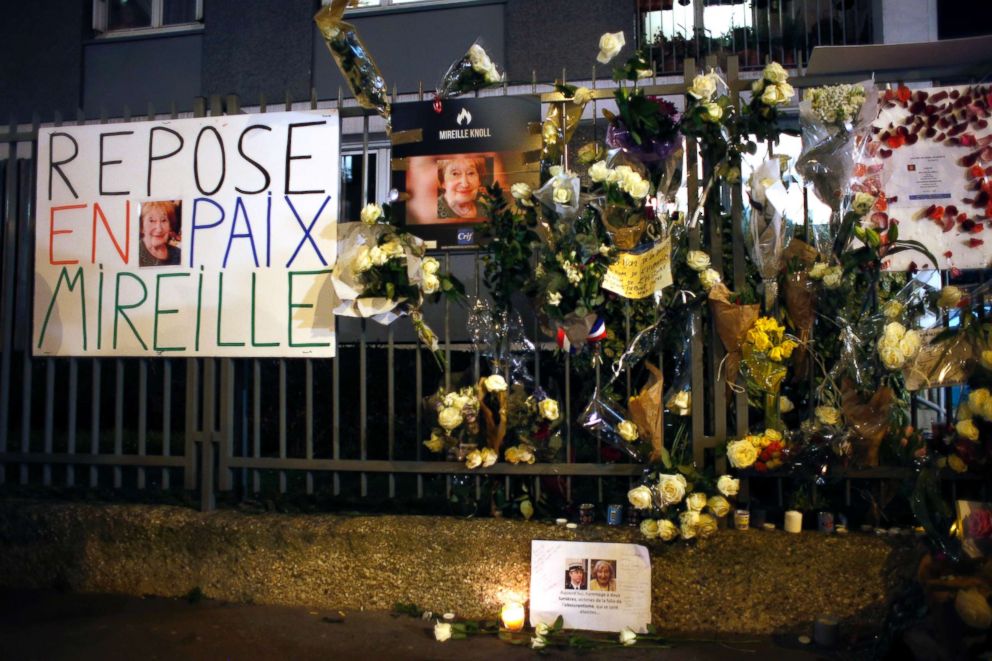 PHOTO: Flowers and placards are displayed outside Mireille Knoll's apartment during a silent march in Paris, France, March 28, 2018. 