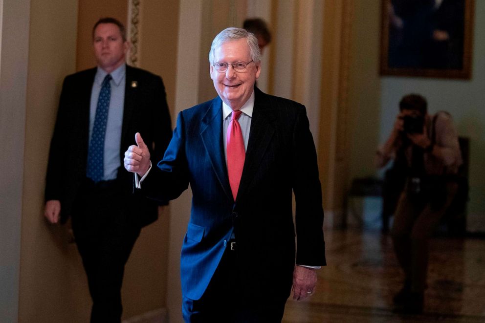 PHOTO: Senate Majority Leader Mitch McConnell smiles as he leaves the Senate floor at the U.S. Capitol, March 25, 2020, in Washington.