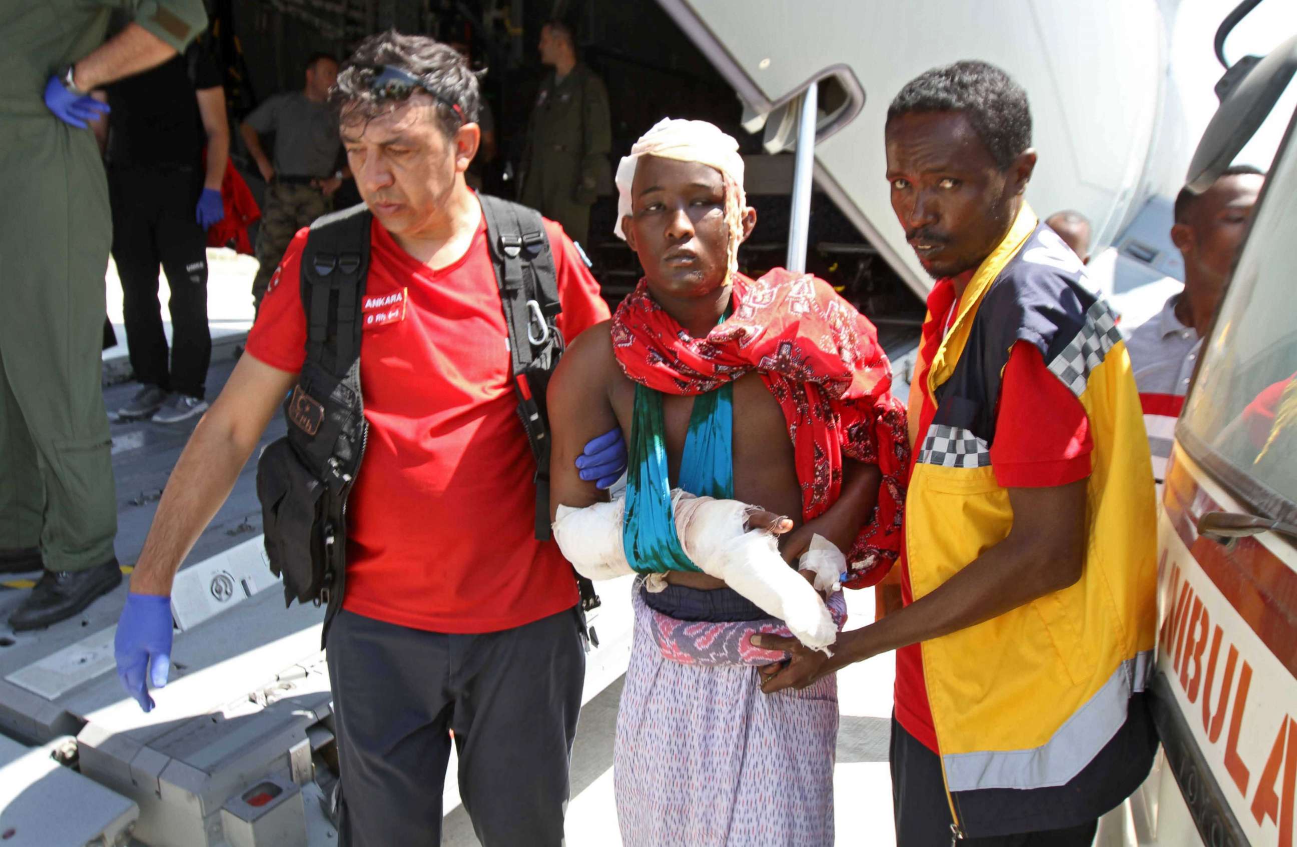 PHOTO: Turkish and Somali paramedics help a wounded man to a Turkish military plane transporting the injured to Turkey at the Mogadishu airport, Oct. 16, 2017, after a truck bomb explosion in the Somali capital. The attack left more than 200 people dead.