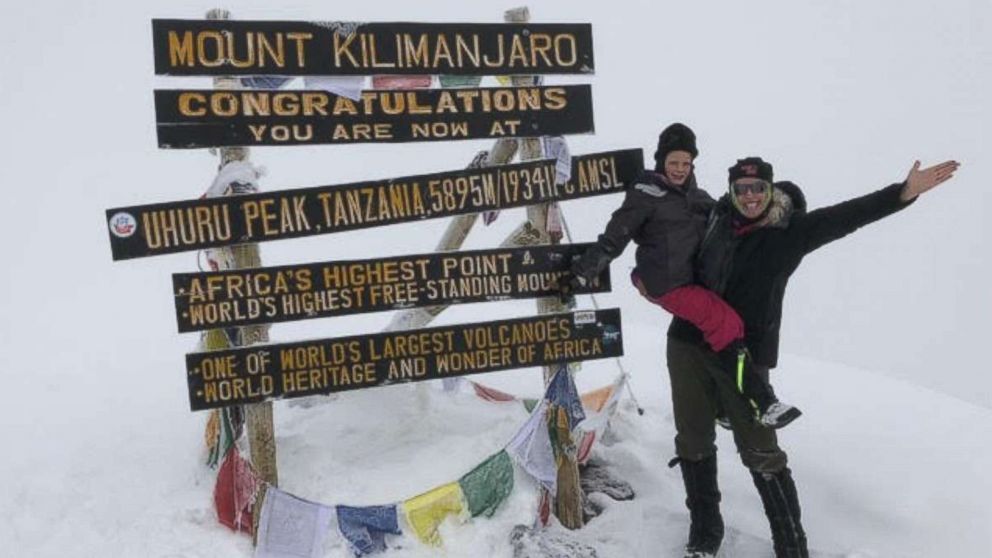 PHOTO: Hollie Kenney and her 7-year-old daughter, Montannah, pose at the summit of Mount Kilimanjaro.