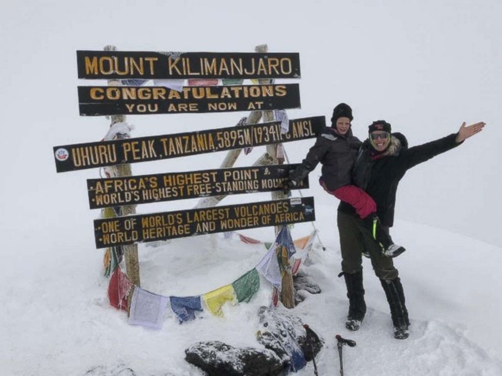 PHOTO: Hollie Kenney and her 7-year-old daughter, Montannah, pose at the summit of Mount Kilimanjaro.