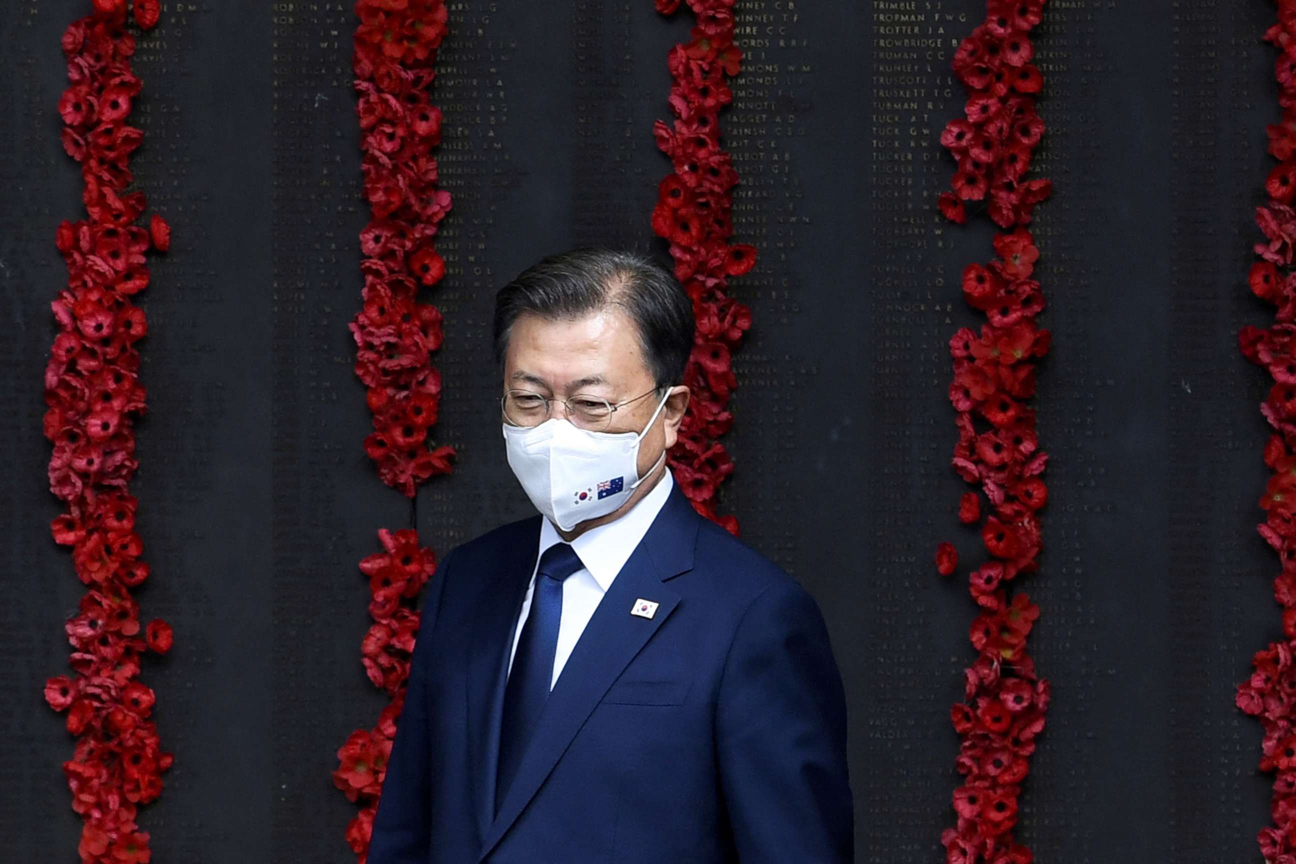 PHOTO: South Korean President Moon Jae-in views the "Roll of Honour" during a visit to the Australian War Memorial in Canberra on Dec. 13, 2021, on the second day of his three-day official visit to Australia.