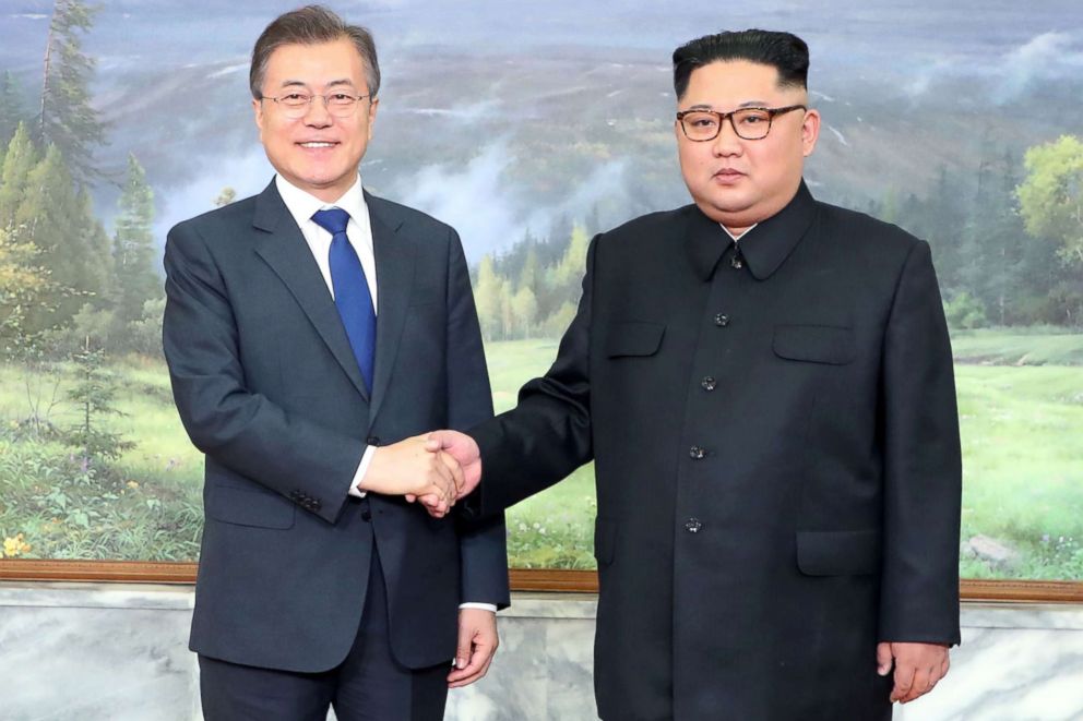 PHOTO: South Korea's President Moon Jae-in (L) shakes hands with North Korea's leader Kim Jong Un before their second summit at the north side of the truce village of Panmunjom in the Demilitarized Zone (DMZ) on May 26, 2018.
