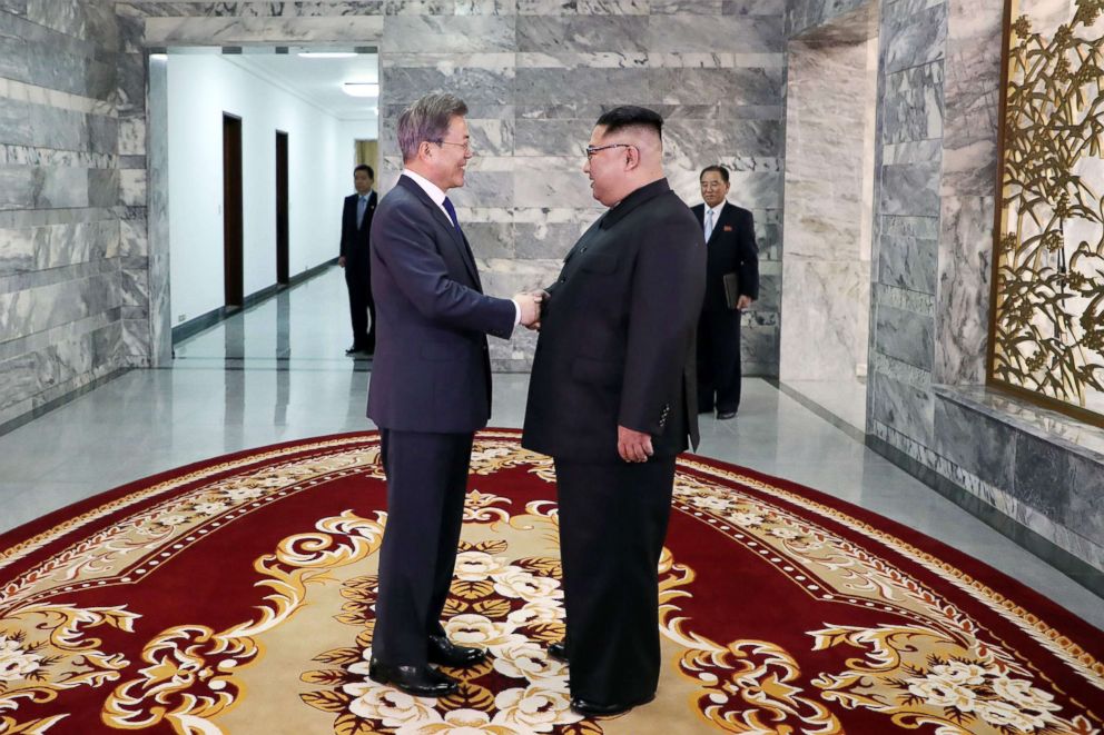 PHOTO: South Korea's President Moon Jae-in (L) shakes hands with North Korea's leader Kim Jong Un before their second summit at the north side of the truce village of Panmunjom in the Demilitarized Zone (DMZ) on May 26, 2018.