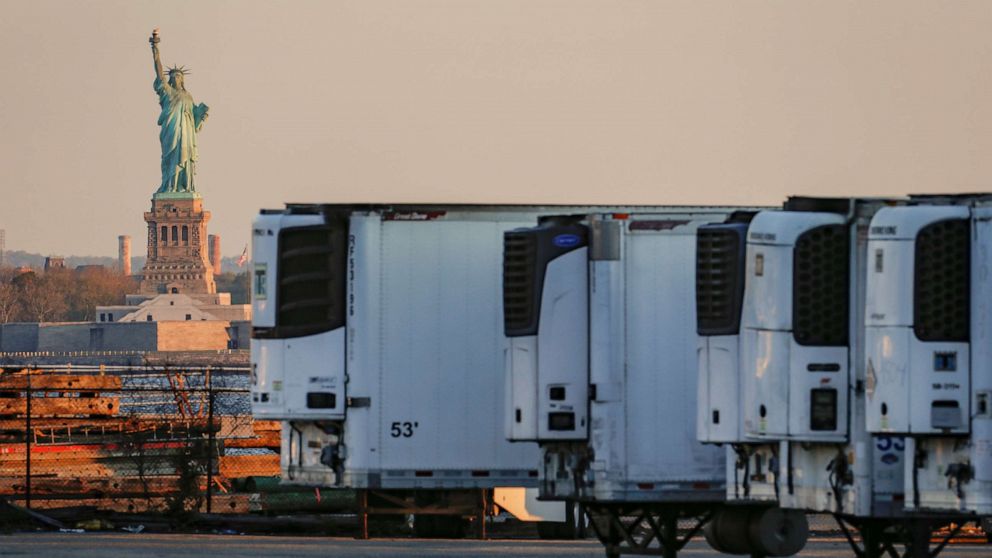 PHOTO: Refrigerated tractor trailers used to store bodies are seen at a temporary morgue, during the outbreak of the coronavirus disease (COVID-19) in the Brooklyn, New York, May 13, 2020.