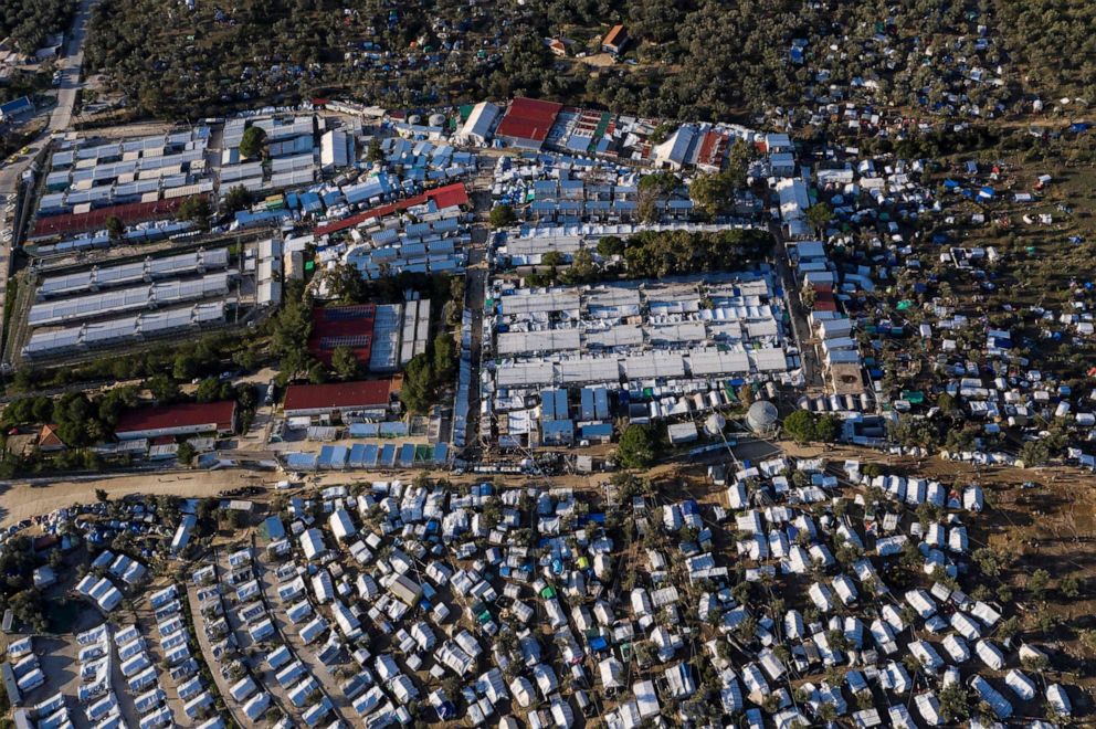 PHOTO: This file photo taken on Dec. 1, 2019, shows an aerial view of the official Moria migrant camp and the makeshift camp around it on the Greek Aegean island of Lesbos.