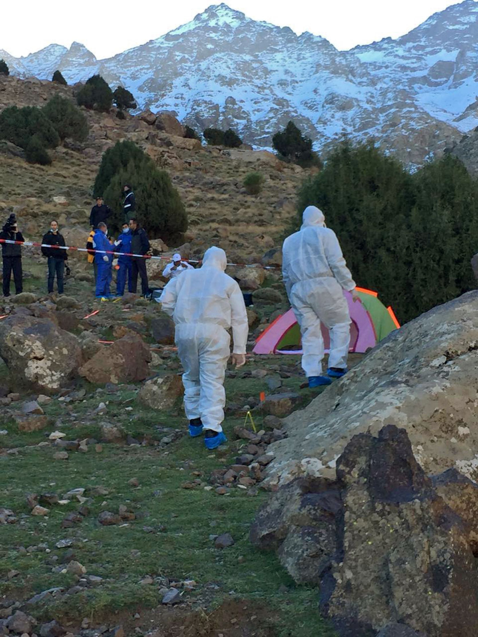 PHOTO: An image grab taken from a video broadcast on Morocco's news channel 2M on Dec. 18, 2018 shows police officers next to a tent at the scene of a crime where the bodies of two Scandinavian women were found the day before.