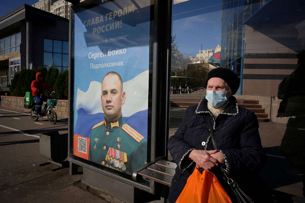 PHOTO: A poster with an image of a Russian service member and a slogan reading "Glory to the Heroes of Russia" decorates a bus stop in Moscow, Russia, on Oct. 11, 2022.