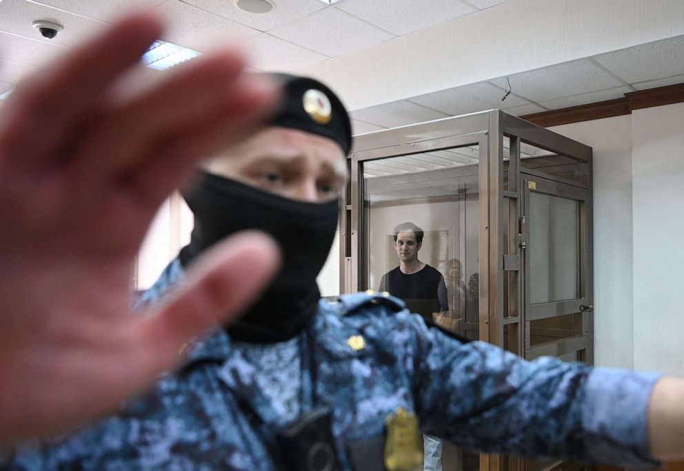 PHOTO: US journalist Evan Gershkovich stands inside a defendants' cage before a hearing to consider an appeal on his extended detention at The Moscow City Court in Moscow on June 22, 2023.
