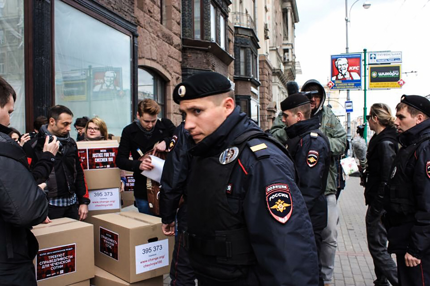 PHOTO: Russian policemen surround Russian gay-rights activists standing next to boxes allegedly containing signed petitions calling for a probe into a reported crackdown on Chechnya's LGBT community, during a rally in central Moscow on May 11, 2017.