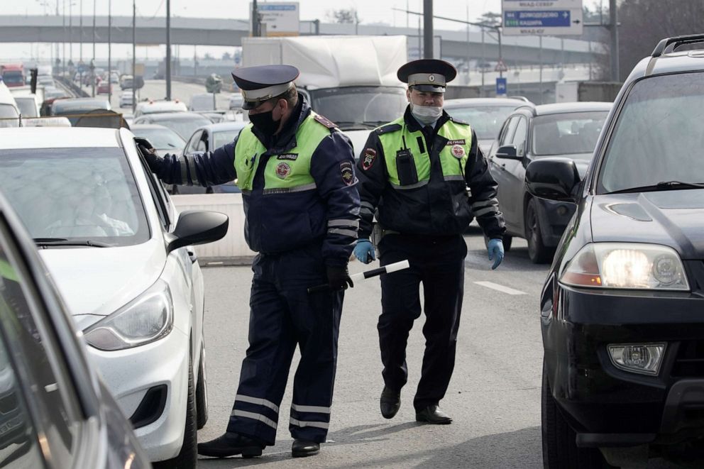 PHOTO: Traffic police officers wearing protective masks work at a checkpoint set up after Moscow authorities tightened up measures to prevent the spread of the coronavirus disease (COVID-19), in Moscow, April 13, 2020.