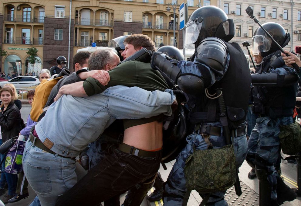 PHOTO: Police officers try to detain protestors during an unsanctioned rally in the center of Moscow, Russia, Aug. 3, 2019.