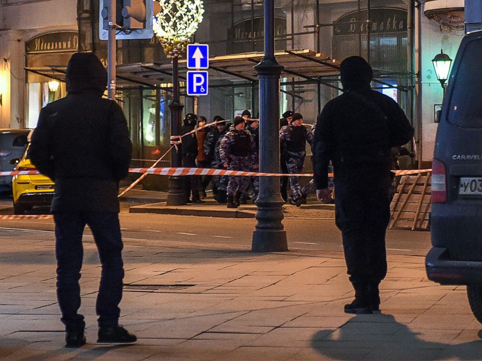 PHOTO: Russian police officers walk along a street next to the FSB security service's office in Moscow after a shooting on Dec. 19, 2019.