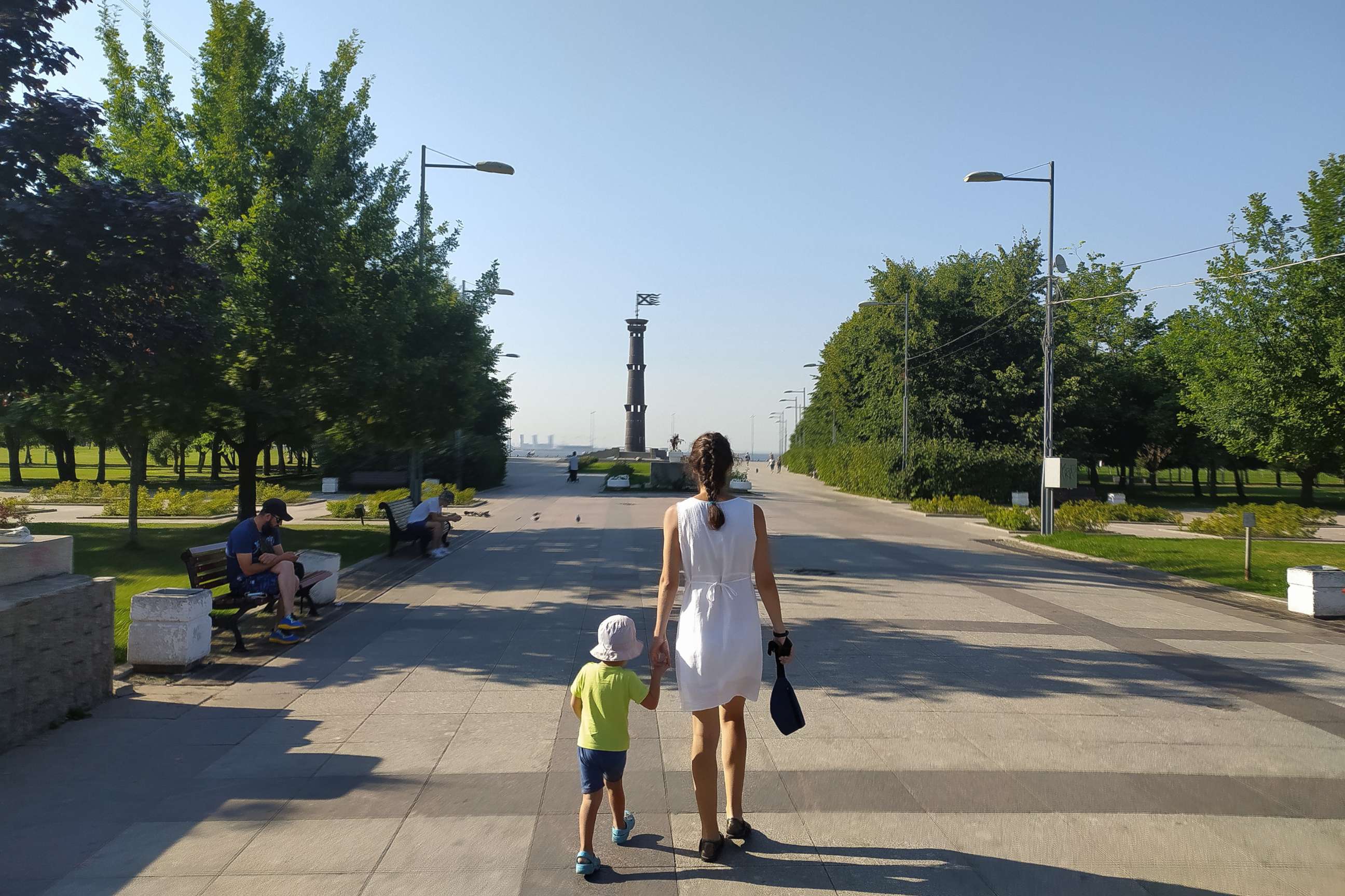 PHOTO: A woman walks with a child, Aug. 20, 2022, in St. Petersburg, Russia.