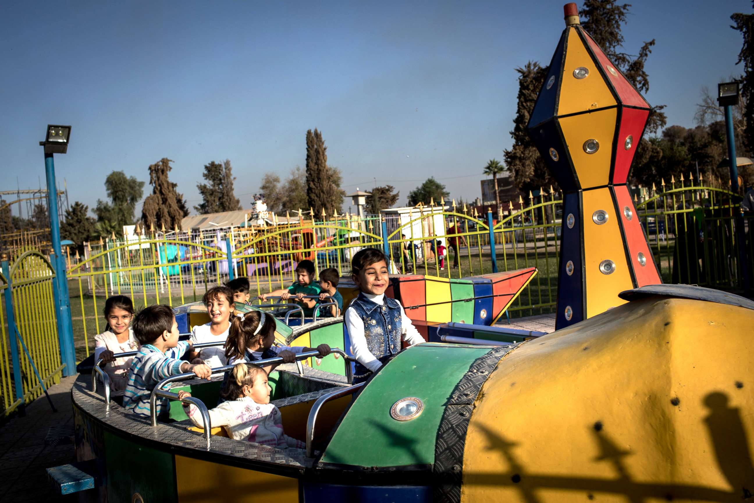 PHOTO: Children enjoy a train ride at the Mosul Amusement Park on Nov. 4, 2017.