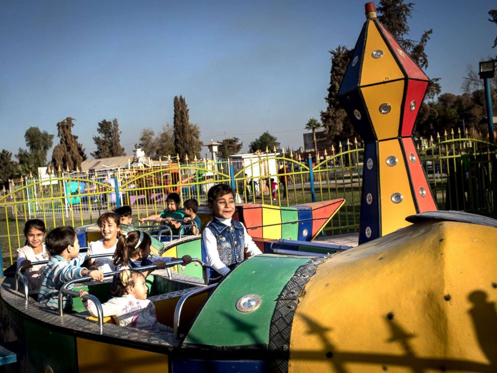 PHOTO: Children enjoy a train ride at the Mosul Amusement Park on Nov. 4, 2017.