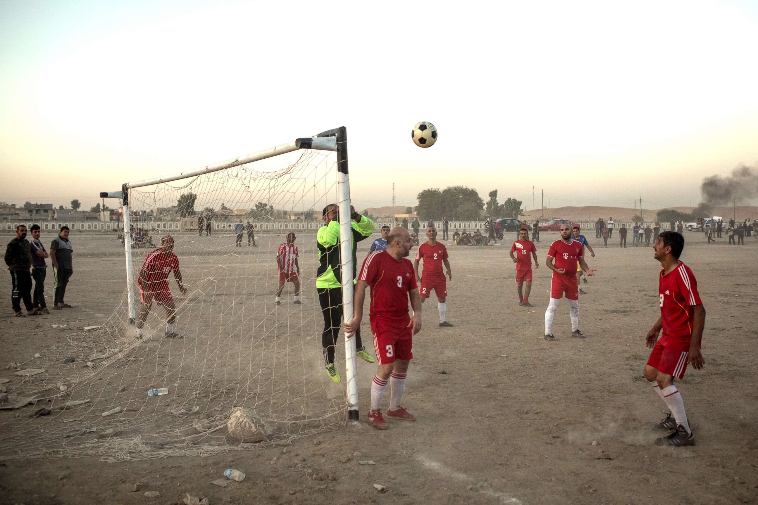 PHOTO: People play football in East Mosul on Nov. 5, 2017. 