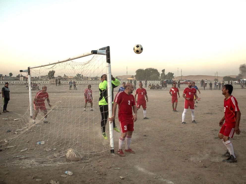 PHOTO: People play football in East Mosul on Nov. 5, 2017.