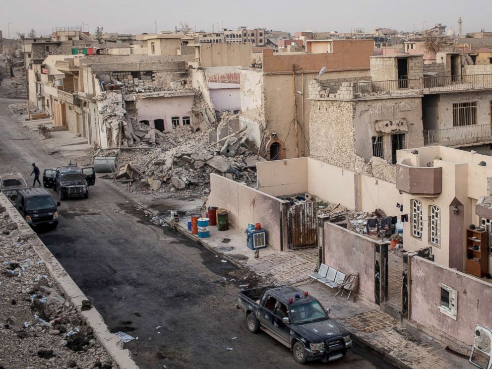 PHOTO: Federal police patrol beside destroyed buildings in West Mosul on Nov. 6, 2017.