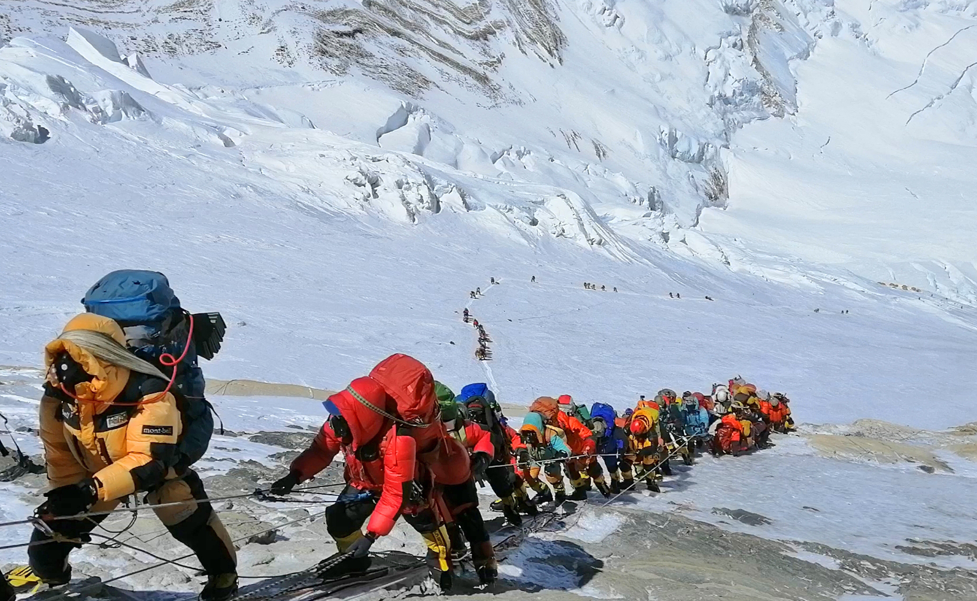 PHOTO: A long queue of mountain climbers line a path on Mount Everest just below camp four, in Nepal, May 22, 2019.