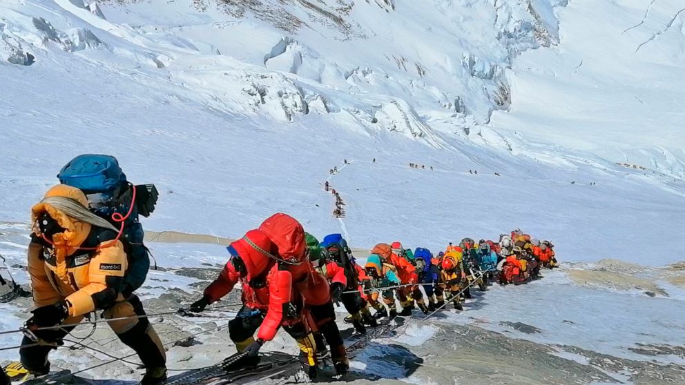PHOTO: A long queue of mountain climbers line a path on Mount Everest just below camp four, in Nepal, May 22, 2019.