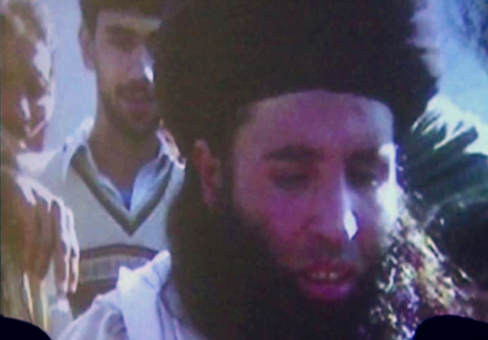 In this file image made from video broadcast on Thursday, Nov. 7, 2013, undated footage of Mullah Fazlullah is shown on a projector in Pakistan.